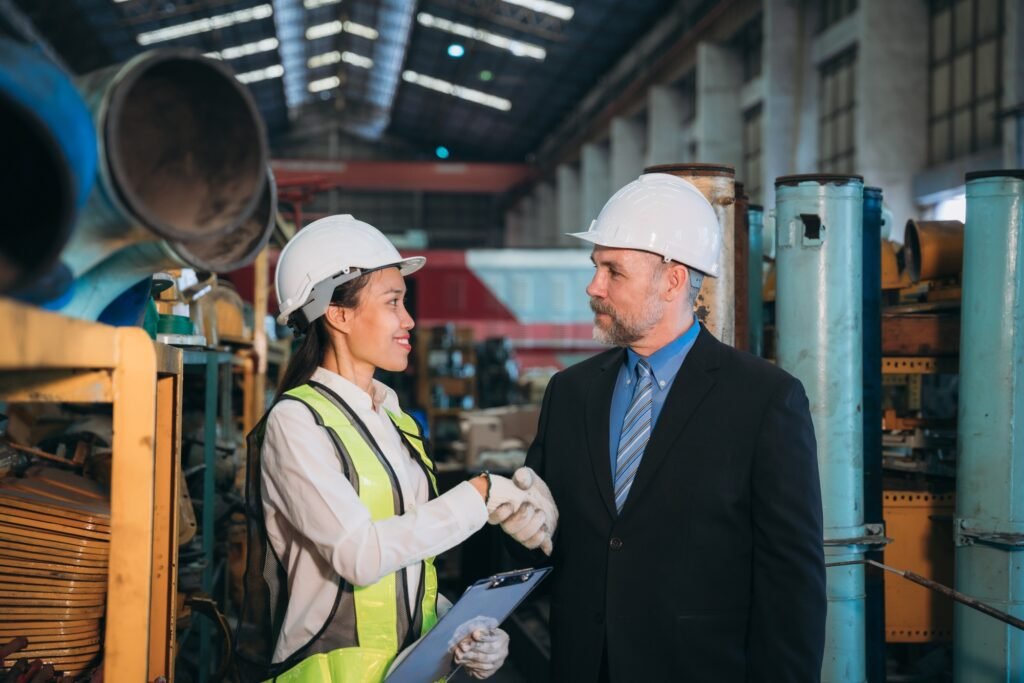 Portrait of Professional Engineers express a high level of confidence and shake hand.